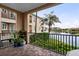 Relaxing balcony area, with views of the lake and community, and adorned with elegant patio furniture at 6 Academy S Way # 221, St Petersburg, FL 33711