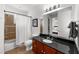 Bathroom boasts dark granite countertops, a bathtub and shower combination, and access to the Primary bedroom at 6 Academy S Way # 221, St Petersburg, FL 33711