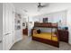 Bedroom includes a bunk bed and charming decor, along with a bathroom view at 6 Academy S Way # 221, St Petersburg, FL 33711