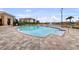 Large community pool, pool deck with lounge chairs and view of buildings at 6 Academy S Way # 221, St Petersburg, FL 33711