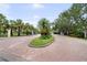 Brick paved driveway leading to the entrance of a well-maintained community at 6 Academy S Way # 221, St Petersburg, FL 33711