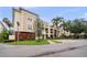 Inviting exterior of the home features lush landscaping, manicured lawns, and a well-maintained facade at 6 Academy S Way # 221, St Petersburg, FL 33711