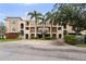 The exterior showcases the home's inviting facade, complemented by mature trees and lush landscaping at 6 Academy S Way # 221, St Petersburg, FL 33711