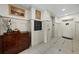 Elegant hallway with stylish decor, featuring an elevator, artwork, and a warm, welcoming ambiance at 6 Academy S Way # 221, St Petersburg, FL 33711