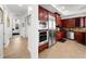 The spacious kitchen boasts stainless steel appliances, rich cabinetry, and a breakfast nook at 6 Academy S Way # 221, St Petersburg, FL 33711