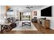 Cozy living room with leather seating, ceiling fan and access to a screened patio at 6 Academy S Way # 221, St Petersburg, FL 33711