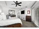 Bright main bedroom features a ceiling fan, plantation shutters and an en suite bathroom at 6 Academy S Way # 221, St Petersburg, FL 33711