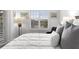 Bright main bedroom with lake view and plush pillows, features shuttered windows and a comfortable, relaxing space at 6 Academy S Way # 221, St Petersburg, FL 33711