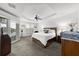 Bright main bedroom features a water view, ceiling fan, and light neutral colors at 6 Academy S Way # 221, St Petersburg, FL 33711