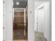 Detailed view of the shower features glass door, tiled walls, and mosaic-tiled flooring at 6 Academy S Way # 221, St Petersburg, FL 33711