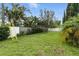 Green backyard surrounded by lush trees, providing a private outdoor space at 6119 31St N Ave, St Petersburg, FL 33710