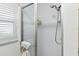 Bathroom features a tiled shower with glass door and a modern shower head at 6119 31St N Ave, St Petersburg, FL 33710