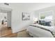Well-lit bedroom with stylish decor, hardwood floors, and cozy ambiance at 6119 31St N Ave, St Petersburg, FL 33710
