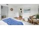 Open bedroom featuring clean design, warm wood floors, and minimalist decor at 6119 31St N Ave, St Petersburg, FL 33710