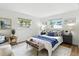 Serene bedroom featuring a comfortable queen bed, stylish decor, and bright, natural light at 6119 31St N Ave, St Petersburg, FL 33710