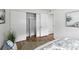 Bedroom featuring modern sliding closet doors and wood flooring at 6119 31St N Ave, St Petersburg, FL 33710