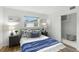 Bright bedroom with queen bed, soft rug, and neutral decor at 6119 31St N Ave, St Petersburg, FL 33710