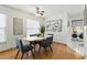 Bright dining area featuring a modern table with gray chairs, plenty of natural light and nearby laundry hookups for added convenience at 6119 31St N Ave, St Petersburg, FL 33710