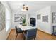 Cozy dining room features a white table with gray chairs, modern art and decor, perfect for everyday meals and entertaining guests at 6119 31St N Ave, St Petersburg, FL 33710