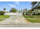 Charming single-story home with well-maintained lawn, fenced yard, and a spacious driveway leading to a one-car garage at 6119 31St N Ave, St Petersburg, FL 33710