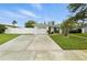 Charming single-story home with well-maintained lawn, fenced yard, and a spacious driveway leading to a one-car garage at 6119 31St N Ave, St Petersburg, FL 33710