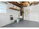 Spacious garage with white brick walls, ample lighting, and storage solutions at 6119 31St N Ave, St Petersburg, FL 33710