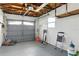 Spacious garage with exposed wood rafters providing additional storage opportunities at 6119 31St N Ave, St Petersburg, FL 33710