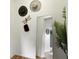 Stylish hallway with a large mirror, decorative wall hangings, and a modern plant at 6119 31St N Ave, St Petersburg, FL 33710