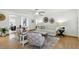 Bright living room with white walls, hardwood floors, modern decor and comfortable seating, perfect for relaxing and entertaining guests at 6119 31St N Ave, St Petersburg, FL 33710