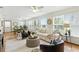 Bright living room with white sofa, modern decor, large windows and comfortable seating arrangement at 6119 31St N Ave, St Petersburg, FL 33710