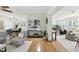 Open concept living space featuring hardwood floors, a dining area, and living room with stylish decor and plenty of natural light at 6119 31St N Ave, St Petersburg, FL 33710