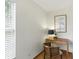 Corner nook showcasing a modern desk and chair, complemented by neutral decor and natural light at 6119 31St N Ave, St Petersburg, FL 33710