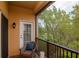 Cozy balcony with a chair, providing a relaxing view of the outdoors and fresh air at 6513 Sand Shore Ln, New Port Richey, FL 34652