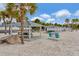 Inviting beachside pavilions with picnic tables, ideal for enjoying outdoor gatherings and relaxation at 6513 Sand Shore Ln, New Port Richey, FL 34652