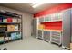 Well-organized garage with storage shelving and cabinets providing ample space at 6513 Sand Shore Ln, New Port Richey, FL 34652