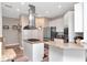 Kitchen with breakfast bar, granite countertops, stainless steel appliances and updated flooring at 6513 Sand Shore Ln, New Port Richey, FL 34652