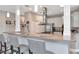 Kitchen with breakfast bar featuring granite countertops, stainless steel appliances and overhead lighting at 6513 Sand Shore Ln, New Port Richey, FL 34652