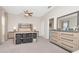 Bedroom featuring a ceiling fan, walk in closet, and neutral walls and gray carpeting at 6513 Sand Shore Ln, New Port Richey, FL 34652