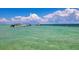 Boats on the water on a beautiful sunny day with fluffy clouds in the distance at 6513 Sand Shore Ln, New Port Richey, FL 34652