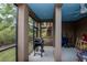 View of the screened patio with a grill and ample space for outdoor enjoyment at 6513 Sand Shore Ln, New Port Richey, FL 34652