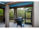 Covered patio featuring a stainless steel grill, perfect for outdoor cooking and dining at 6513 Sand Shore Ln, New Port Richey, FL 34652