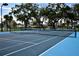 A full tennis court is available, surrounded by mature trees in this active community at 6513 Sand Shore Ln, New Port Richey, FL 34652