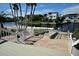 Private waterfront access with a walkway, leading to a neighborhood canal and docks at 6513 Sand Shore Ln, New Port Richey, FL 34652