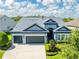 Stunning aerial view of the home showcasing its well-maintained landscaping, driveway, and roof at 6817 Ebb Tide Ave, Apollo Beach, FL 33572