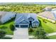 Expansive aerial view of the beautiful home, showcasing its lush green lawn and roof at 6817 Ebb Tide Ave, Apollo Beach, FL 33572