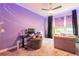 Bright bedroom features a desk area and curtains over two windows at 6817 Ebb Tide Ave, Apollo Beach, FL 33572