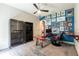 Office/bedroom boasts a unique glass desk and a gallery wall at 6817 Ebb Tide Ave, Apollo Beach, FL 33572