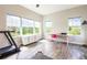 Bonus room featuring multiple windows and wood-look floors at 6817 Ebb Tide Ave, Apollo Beach, FL 33572