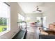 Bonus room with many windows and wood-look flooring at 6817 Ebb Tide Ave, Apollo Beach, FL 33572