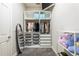 Walk-in closet with custom shelving and hanging space at 6817 Ebb Tide Ave, Apollo Beach, FL 33572